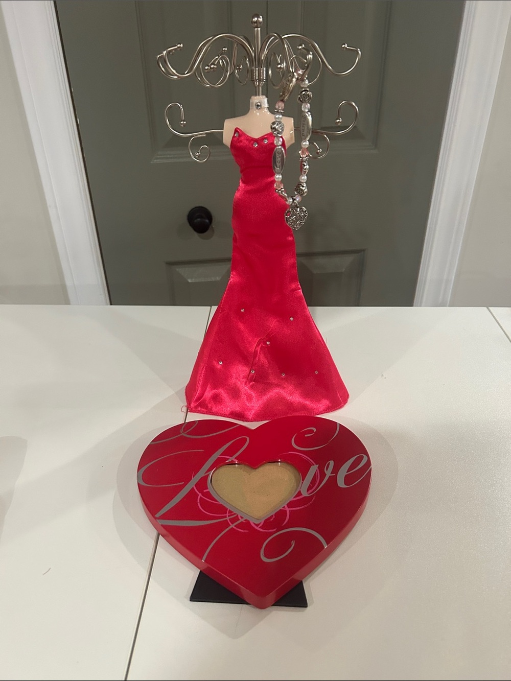 Red Dress Jewelry Stand with Silver Accent Necklace